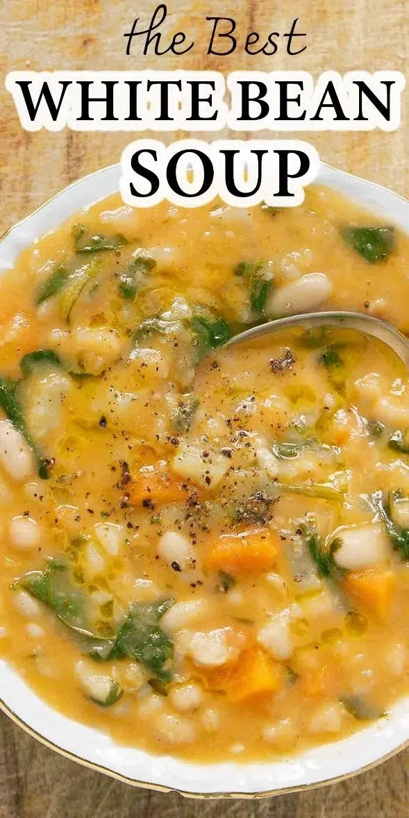 Bowl of flavor-packed white bean soup with fresh herbs and vegetables