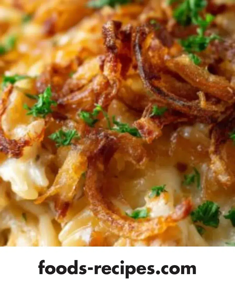 French Onion Chicken Orzo Casserole topped with melted cheese and herbs