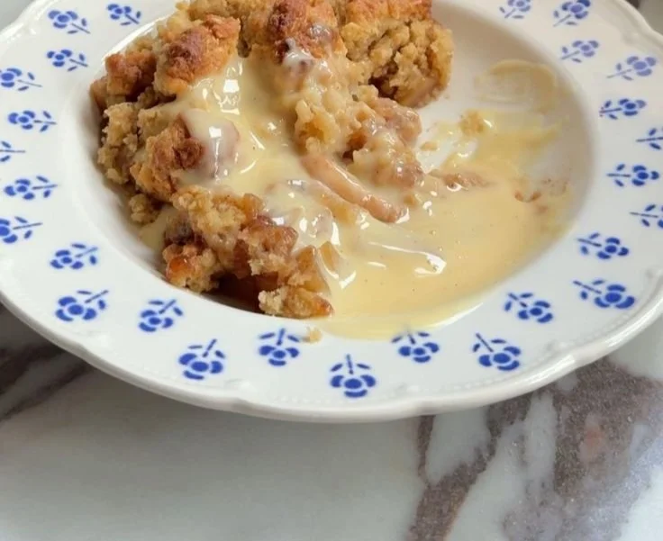Delicious Apple Pear Crumble topped with golden crumble and served in a bowl.