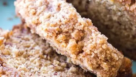 Slices of Coffee Cake Banana Bread served on a plate with coffee