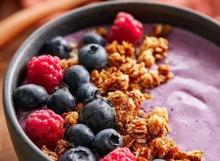 Colorful and nutritious easy smoothie breakfast bowl with fruits and toppings