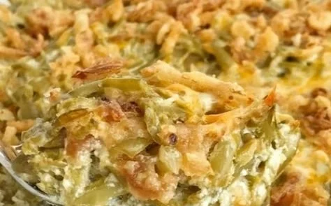 Delicious homemade green bean casserole with crispy onions and creamy sauce.