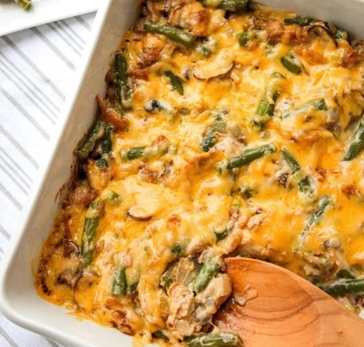 Delicious Paula Deen's green bean casserole topped with crispy onions.
