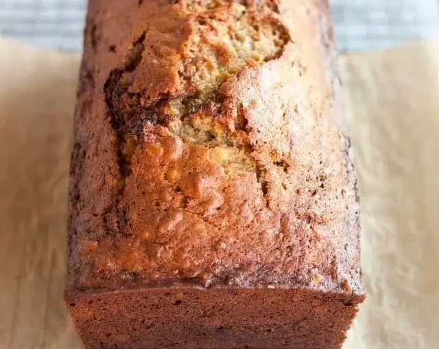 Simple Banana Bread 2 Loaf of simple homemade banana bread on a wooden table