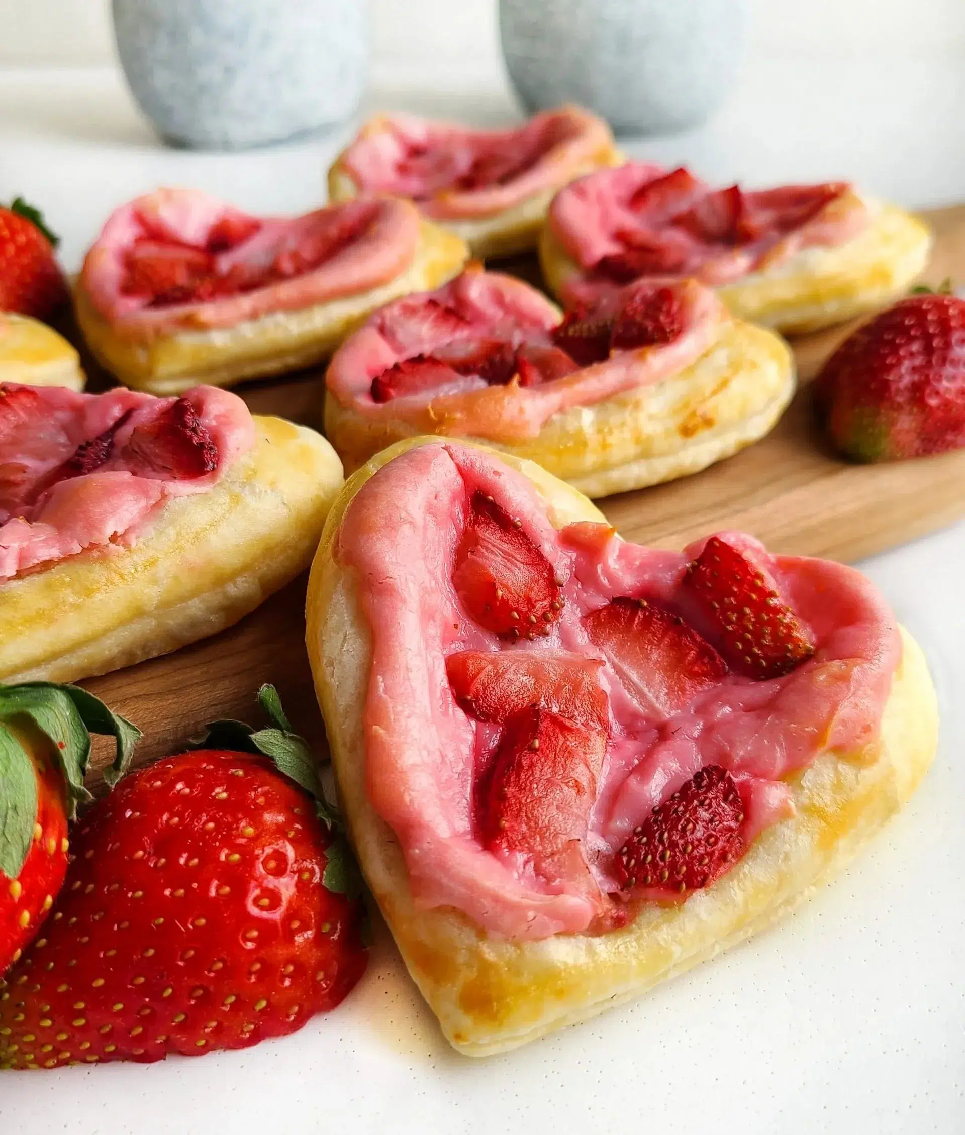 Strawberry cream cheese heart danishes on a plate
