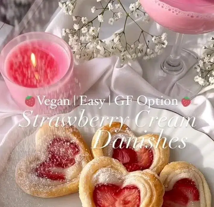 Strawberry puff pastry danishes topped with fresh strawberries and icing
