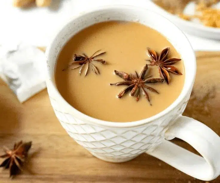 A variety of tea leaves and brewed tea in a cup for tea enthusiasts.