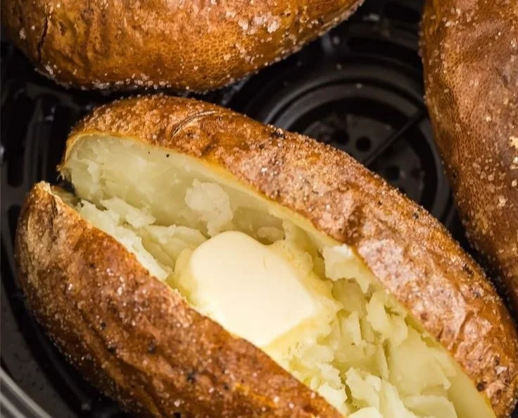 Air fryer baked potato with crispy skin and fluffy interior