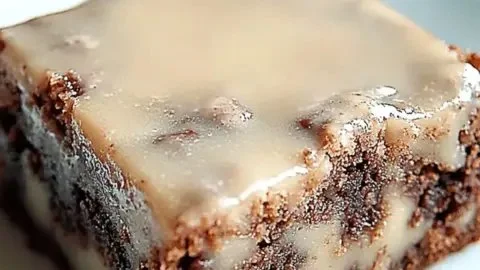 Delicious banana bread brownies topped with chocolate and walnuts