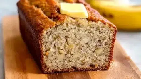 Fluffy buttermilk banana bread fresh out of the oven, golden and delicious.