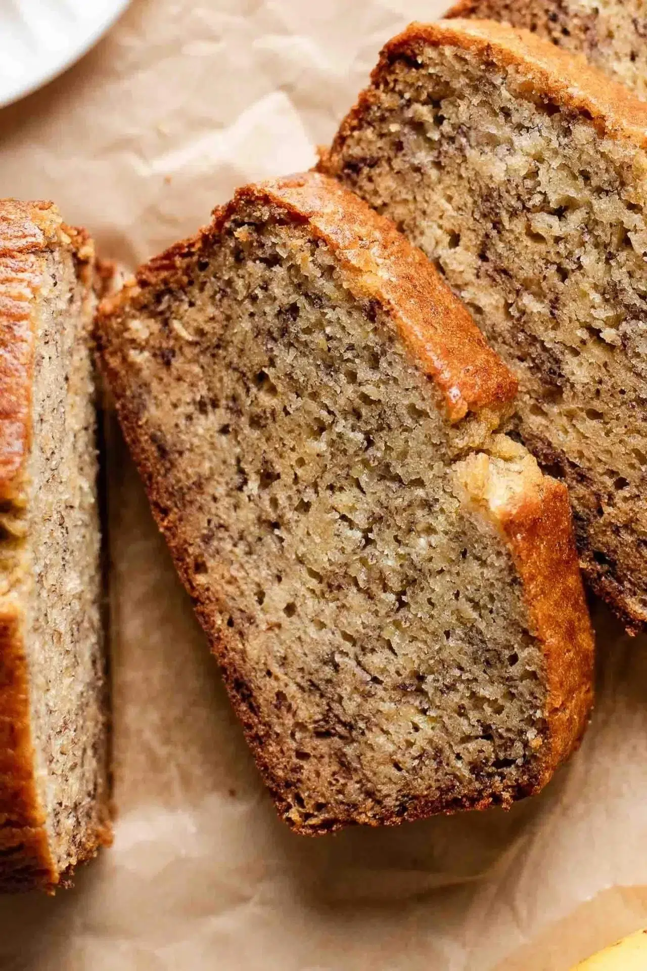 Freshly baked homemade banana bread on a wooden cutting board